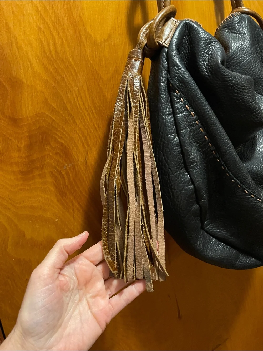 Black Hobo Bag with Brown Braided Strap and Tassel